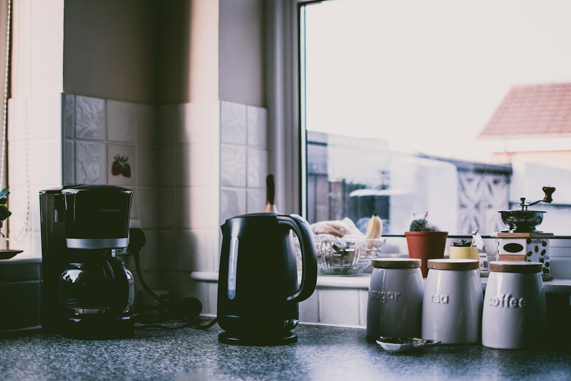 Kitchen counter with cooking accessories and air fryer setup