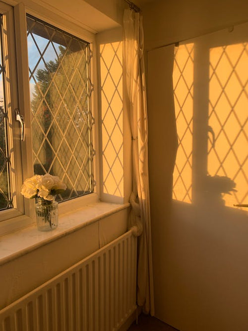 Golden sunset ambient light casting warm glow in room