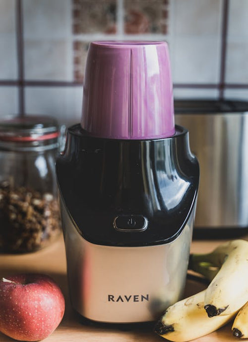 Portable cordless blender with fresh fruit ready for smoothie